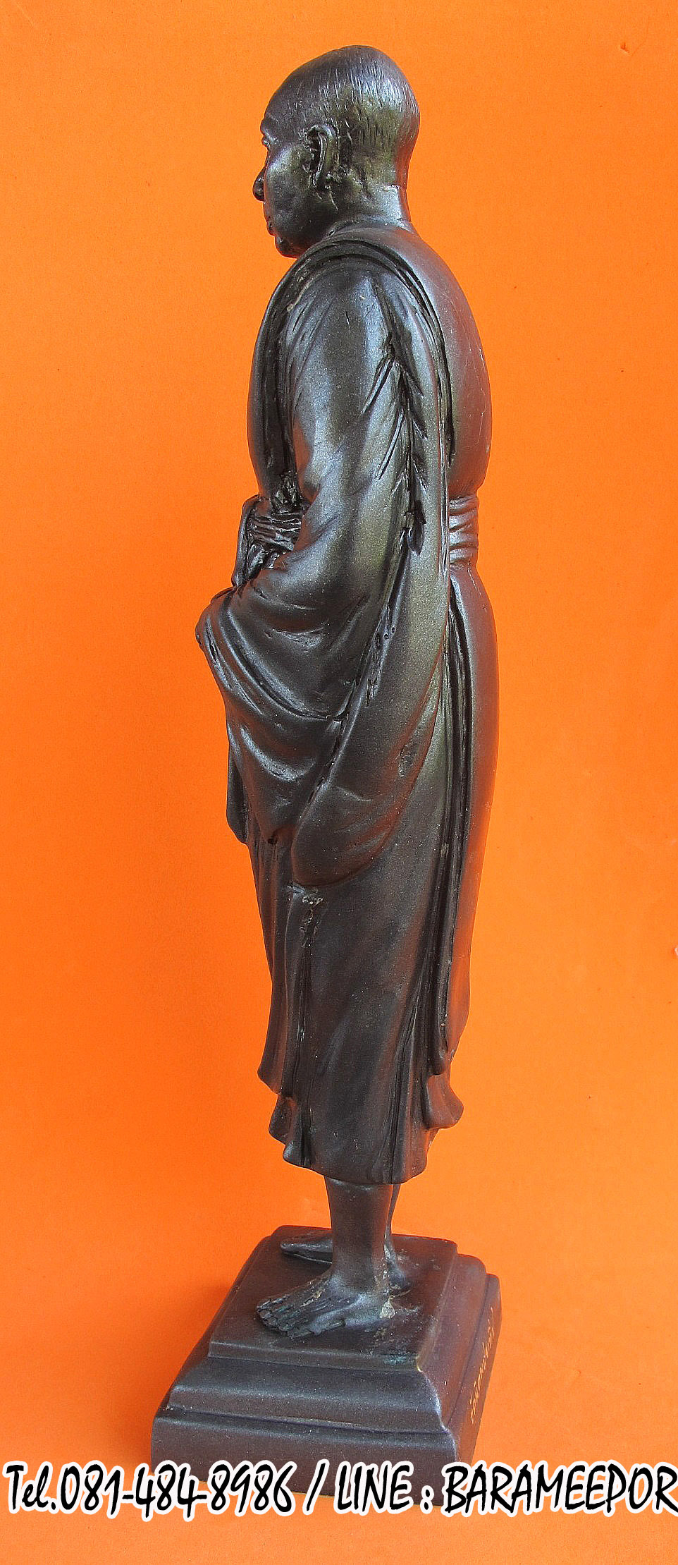 พระบูชายืน,หลวงพ่อหวน,วัดนิคมประทีป(วัดโคกหล่อ),ตรัง,รุ่นฉลองพัตรยศ ๗ รอบ ปี ๒๕๕๔ เนื้อทองแดงรมดำ