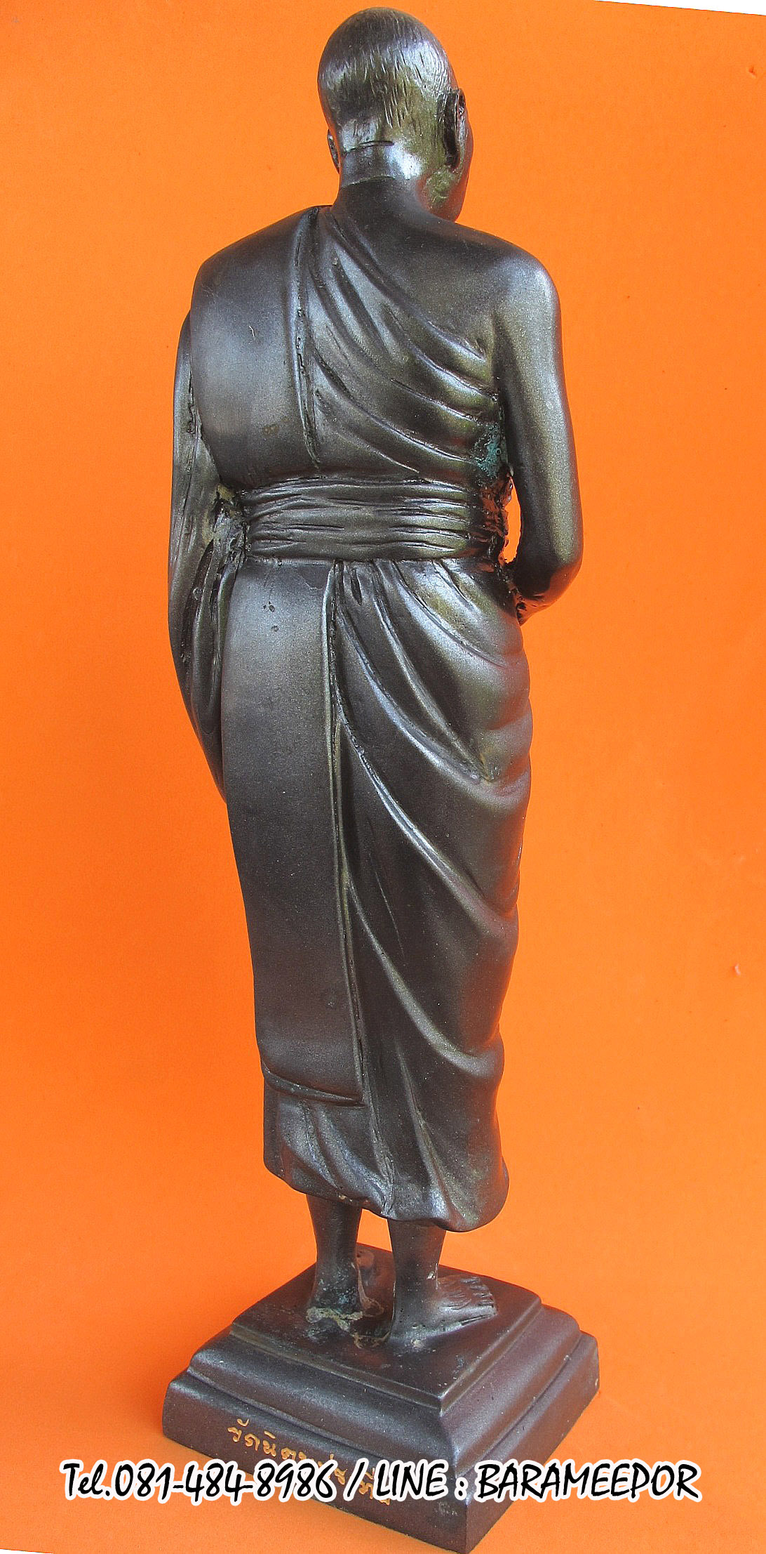 พระบูชายืน,หลวงพ่อหวน,วัดนิคมประทีป(วัดโคกหล่อ),ตรัง,รุ่นฉลองพัตรยศ ๗ รอบ ปี ๒๕๕๔ เนื้อทองแดงรมดำ