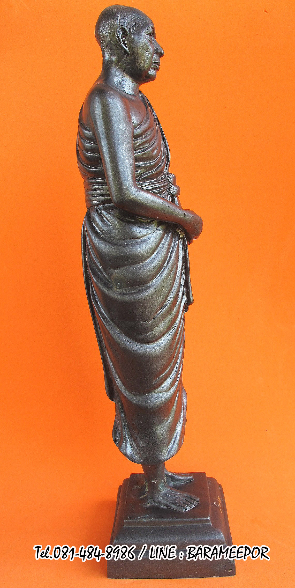 พระบูชายืน,หลวงพ่อหวน,วัดนิคมประทีป(วัดโคกหล่อ),ตรัง,รุ่นฉลองพัตรยศ ๗ รอบ ปี ๒๕๕๔ เนื้อทองแดงรมดำ