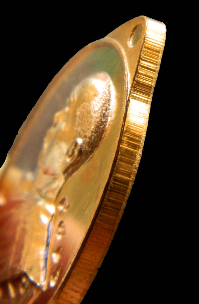 เหรียญหันข้างหลวงพ่อคูณ วัดบ้านไร่ รุ่นเจ้าสัว สร้างโดย บอยท่าพระจันทร์ ปี 2557 เนื้อทองแดงผิวไฟ