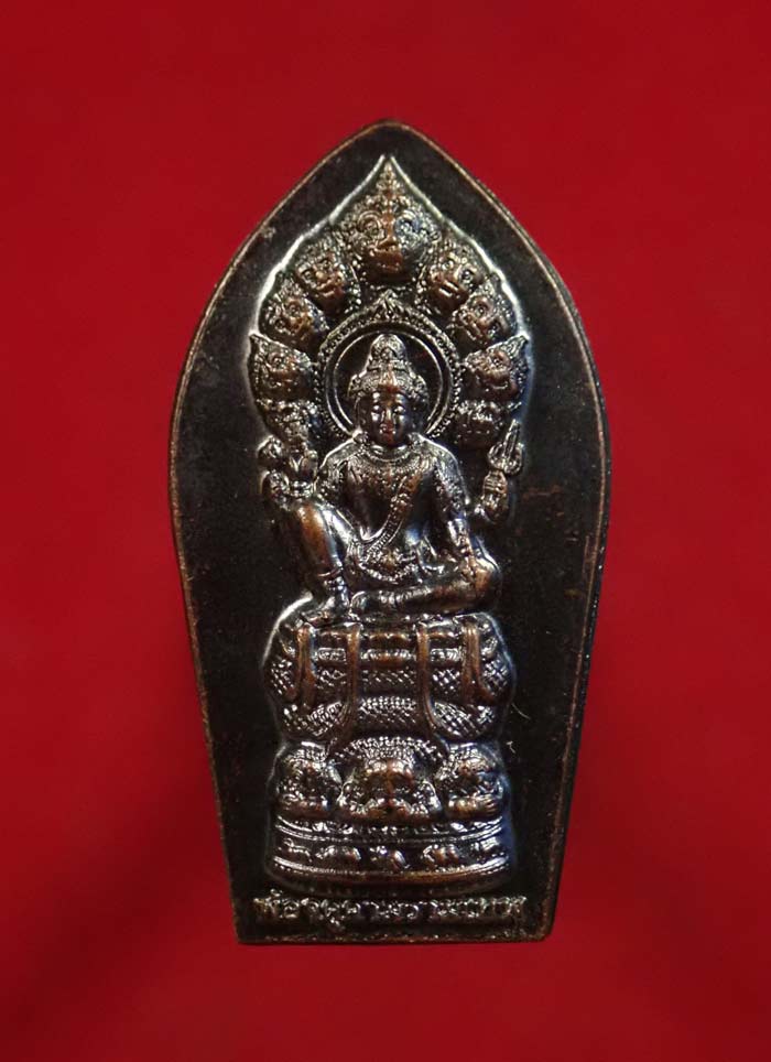 ปรกปฐมใบมะขาม ปางปฎิหาริย์ นาคราชปรก 9 เศียร หลังยันต์เรือนพระเทวราช องค์ราชันองค์พ่อจตุคามรามเทพวิหารจังหวัดนราธิวาส ปี 2565 เนื้อทองแดงรมดำ (ตอกโค๊ต)