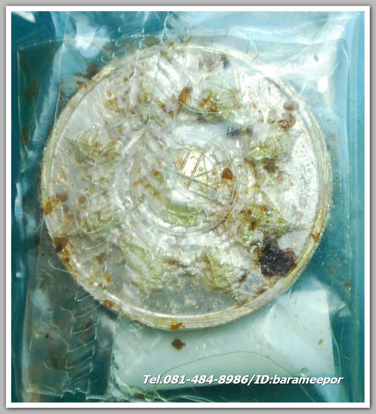 เหรียญพระปิดตาพังพะกาฬ "เจ้าสัวพันล้าน" (บอย ท่าพระจันทร์) เนื้อเงิน แช่น้ำมันเสือ