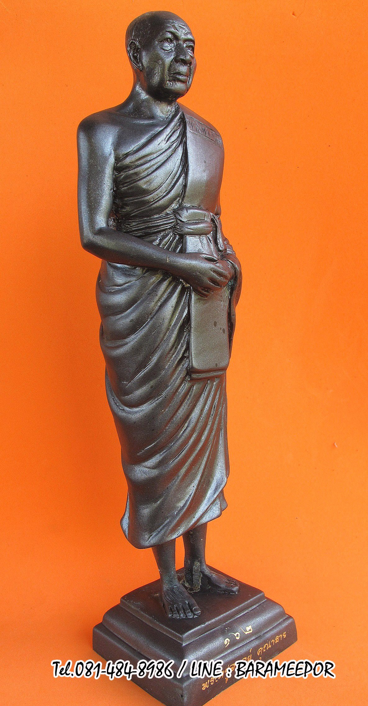 พระบูชายืน,หลวงพ่อหวน,วัดนิคมประทีป(วัดโคกหล่อ),ตรัง,รุ่นฉลองพัตรยศ ๗ รอบ ปี ๒๕๕๔ เนื้อทองแดงรมดำ