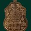 เหรียญท้าวเวสสุวรรณ รุ่นโชคดี วัดถ้ำยะลา ปี 2561 พิมพ์เล็ก ขนาดพระสูง 2.5 ซ.ม. เนื้อทองแดงลงยาพื้นขาวขอบแดง